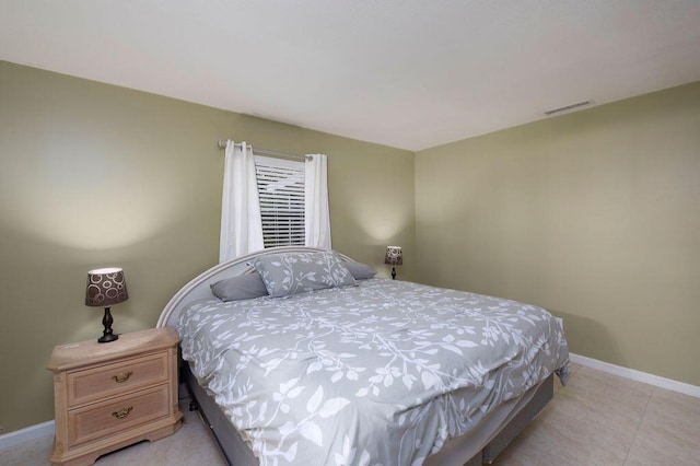 1967 SW Ember St, Port Saint Lucie, FL 34953 - bedroom featuring baseboards and light tile patterned flooring