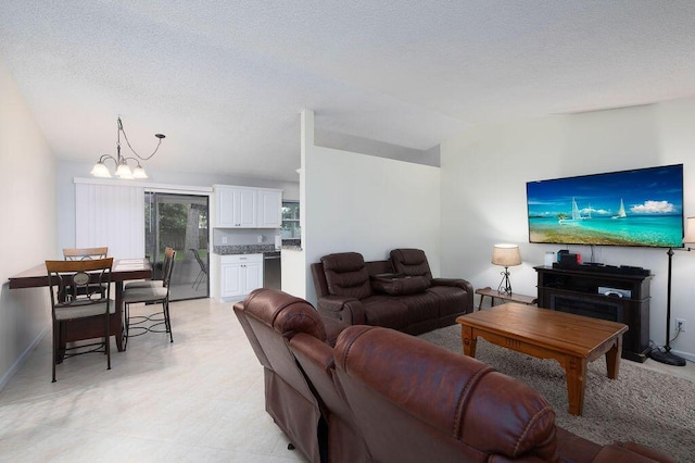 1967 SW Ember St, Port Saint Lucie, FL 34953 - living area featuring a chandelier, vaulted ceiling, and a textured ceiling