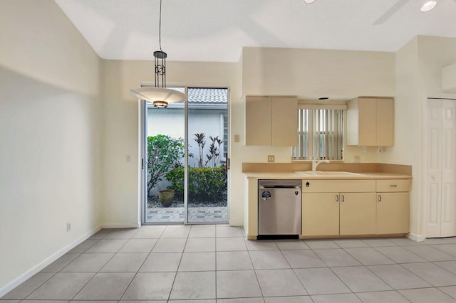 11857 Fountainside Cir, Boynton Beach, FL 33437 - kitchen with stainless steel dishwasher, cream cabinets, light countertops, and pendant lighting