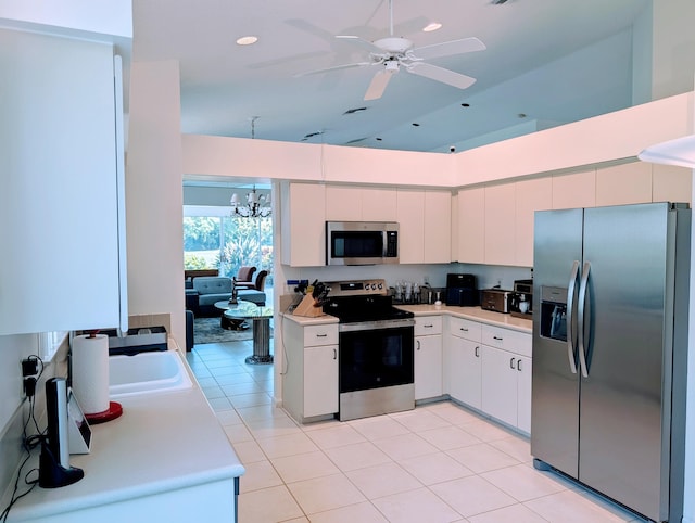 11857 Fountainside Cir, Boynton Beach, FL 33437 - kitchen featuring stainless steel appliances, light countertops, a chandelier, white cabinetry, and recessed lighting