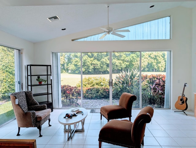 11857 Fountainside Cir, Boynton Beach, FL 33437 - living area with vaulted ceiling, a ceiling fan, and light tile patterned floors