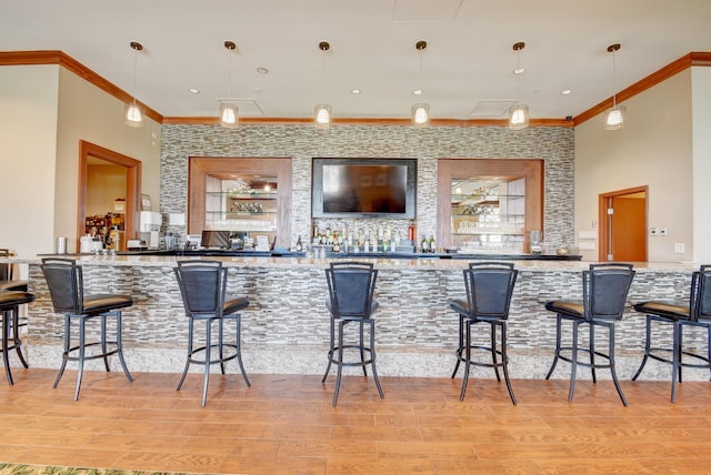 11857 Fountainside Cir, Boynton Beach, FL 33437 - community bar area featuring ornamental molding, light wood-type flooring, and decorative light fixtures