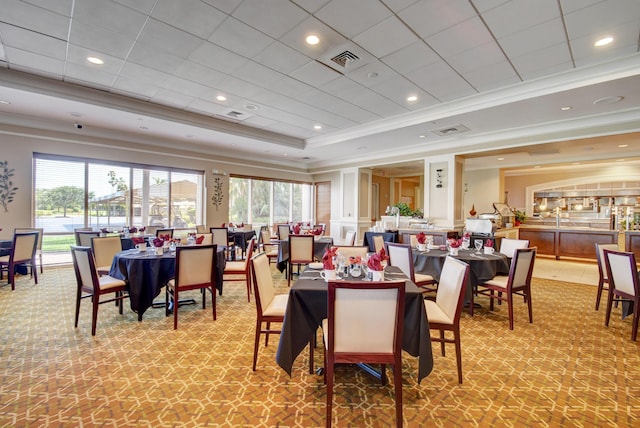 11857 Fountainside Cir, Boynton Beach, FL 33437 - dining area with ornamental molding, healthy amount of natural light, a tray ceiling, and light colored carpet