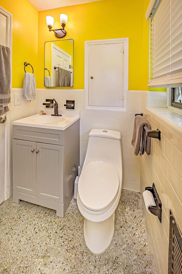 1606 16th Ave N, Lake Worth Beach, FL 33460 - bathroom with tile walls, vanity, and a wainscoted wall