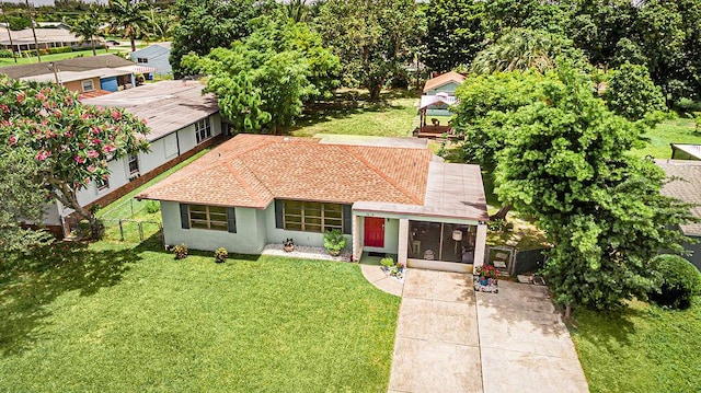 1606 16th Ave N, Lake Worth Beach, FL 33460 - view of front facade with stucco siding, a gazebo, and driveway