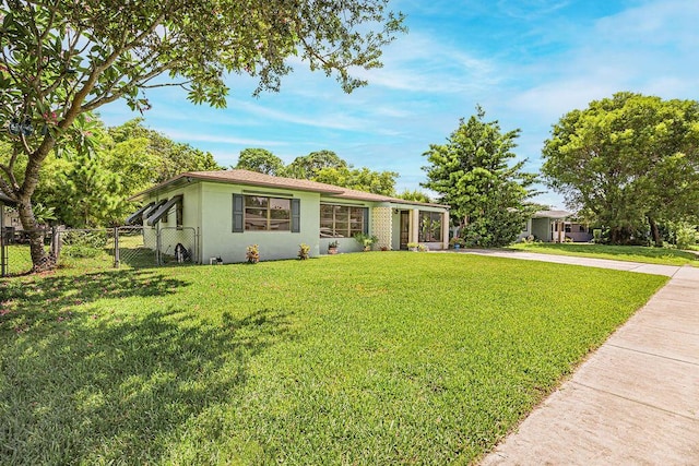 1606 16th Ave N, Lake Worth Beach, FL 33460 - ranch-style home with stucco siding and driveway