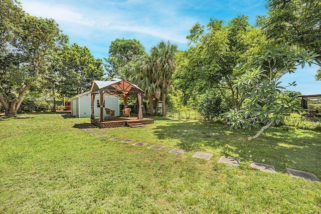 1606 16th Ave N, Lake Worth Beach, FL 33460 - fenced backyard featuring a gazebo, a wooden deck, and an outbuilding