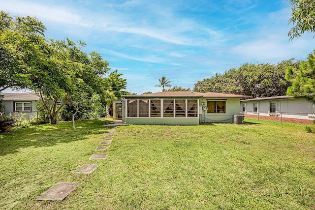 1606 16th Ave N, Lake Worth Beach, FL 33460 - rear view of house with a sunroom