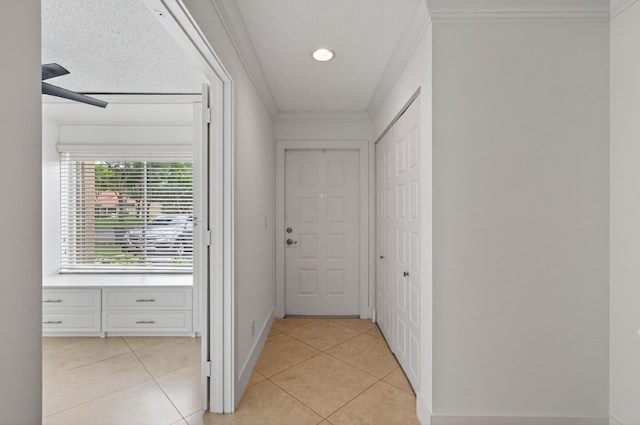 9850 Kamena Cir, Boynton Beach, FL 33436 - corridor with light tile patterned flooring and ornamental molding
