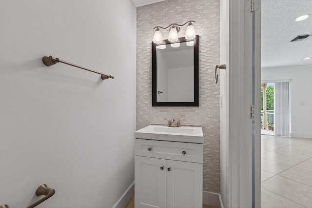 9850 Kamena Cir, Boynton Beach, FL 33436 - bathroom featuring vanity, a textured ceiling, and tile patterned flooring