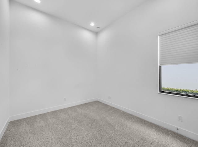 13058 Artisan Cir, Palm Beach Gardens, FL 33418 - carpeted spare room featuring baseboards and recessed lighting