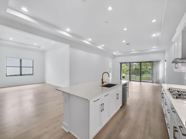 13058 Artisan Cir, Palm Beach Gardens, FL 33418 - kitchen with open floor plan, appliances with stainless steel finishes, light stone counters, light wood-style flooring, and recessed lighting