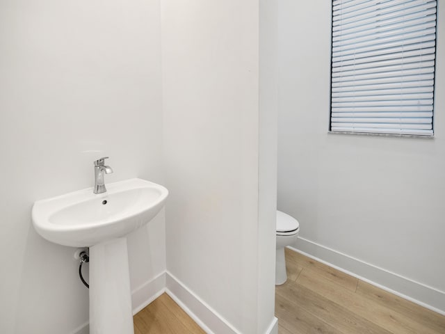 13058 Artisan Cir, Palm Beach Gardens, FL 33418 - bathroom featuring toilet and wood finished floors