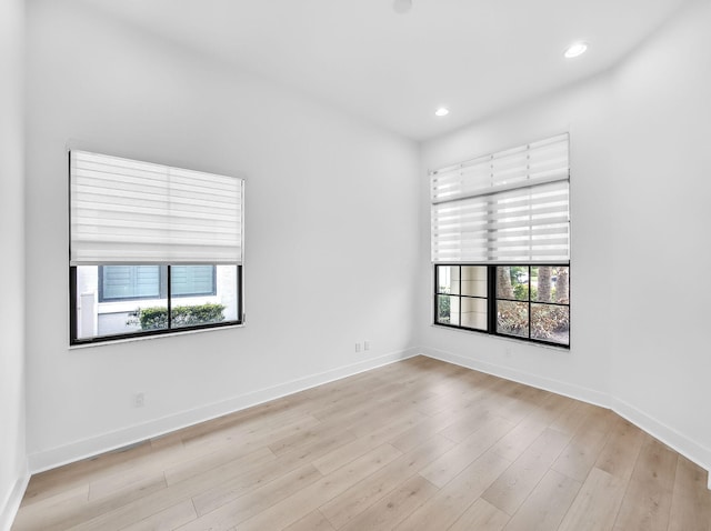 13058 Artisan Cir, Palm Beach Gardens, FL 33418 - unfurnished room with healthy amount of natural light, light wood-style floors, and recessed lighting