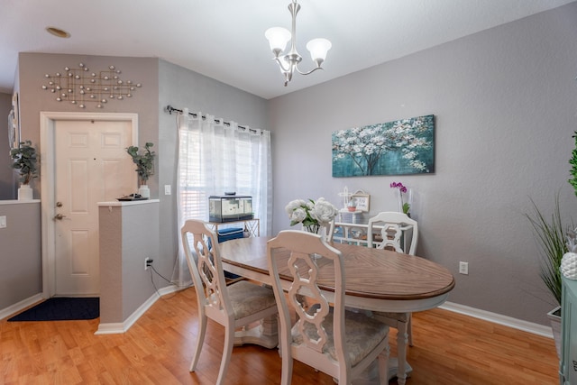 161 Lake Monterey Cir, Boynton Beach, FL 33426 - dining room featuring light wood-style floors and a chandelier