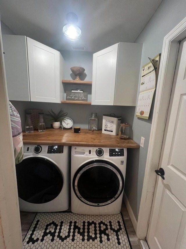 2457 SE Shipping Rd, Port Saint Lucie, FL 34952 - laundry area with cabinet space and washer and clothes dryer