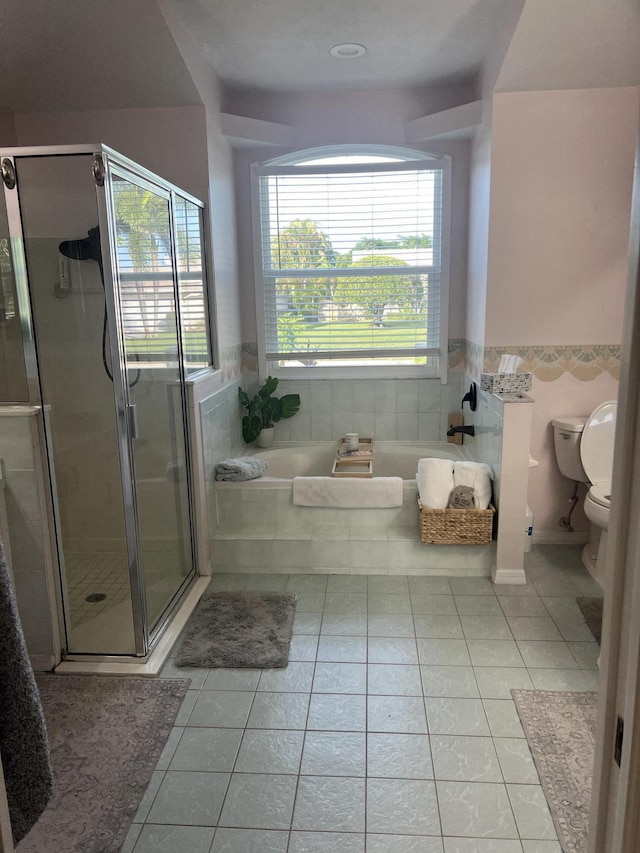 2457 SE Shipping Rd, Port Saint Lucie, FL 34952 - bathroom featuring tile patterned flooring, a garden tub, and a stall shower