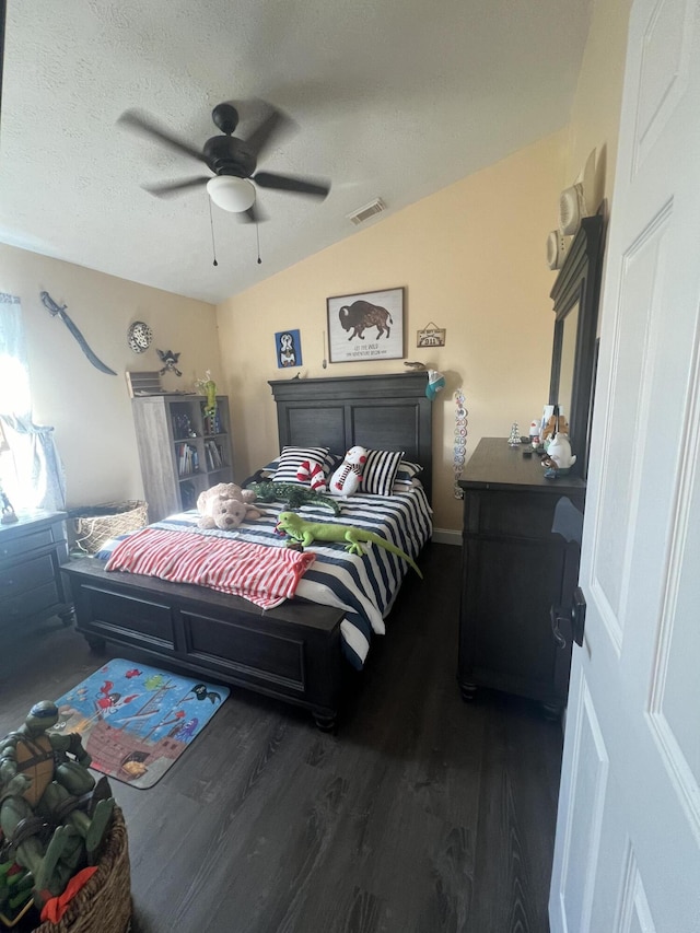 2457 SE Shipping Rd, Port Saint Lucie, FL 34952 - bedroom featuring wood finished floors, a ceiling fan, vaulted ceiling, and a textured ceiling