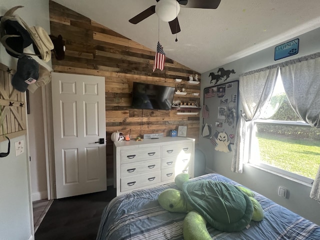2457 SE Shipping Rd, Port Saint Lucie, FL 34952 - bedroom with vaulted ceiling, wood walls, and a ceiling fan