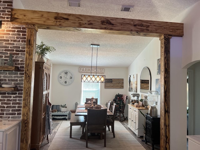 2457 SE Shipping Rd, Port Saint Lucie, FL 34952 - dining space with a textured ceiling and arched walkways