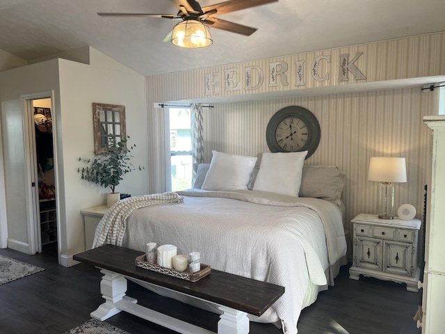 2457 SE Shipping Rd, Port Saint Lucie, FL 34952 - bedroom with dark wood-style flooring, lofted ceiling, a closet, a ceiling fan, and a walk in closet