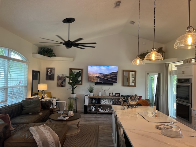 2457 SE Shipping Rd, Port Saint Lucie, FL 34952 - living room with a ceiling fan, dark wood-type flooring, and high vaulted ceiling