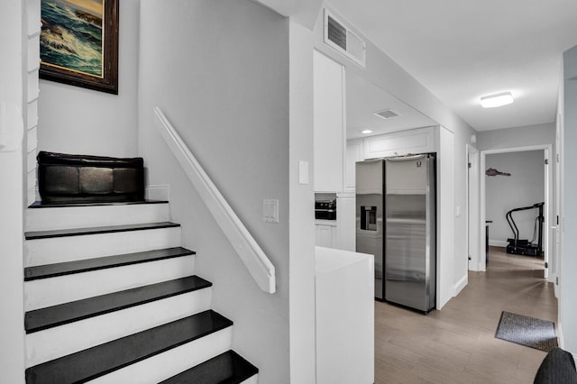 8291 Thames Blvd Unit C, Boca Raton, FL 33433 - staircase with wood finished floors and baseboards