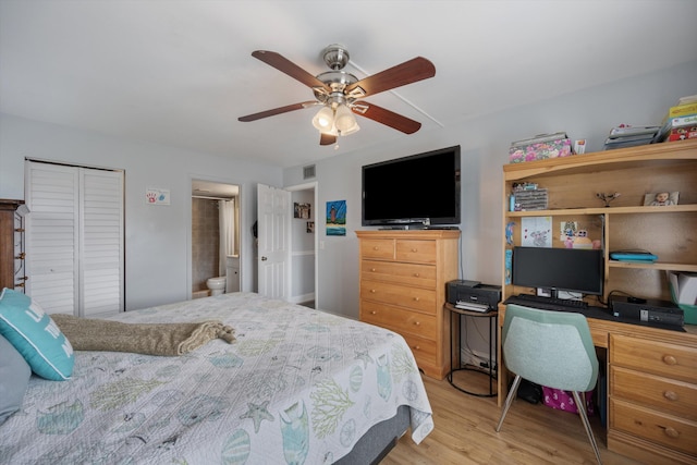 624 Sea Pine Way Unit A2, Greenacres, FL 33415 - bedroom featuring wood finished floors, a desk, a ceiling fan, a closet, and ensuite bathroom