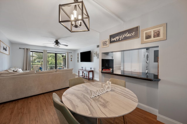 624 Sea Pine Way Unit A2, Greenacres, FL 33415 - dining area featuring ceiling fan, wood finished floors, and a chandelier