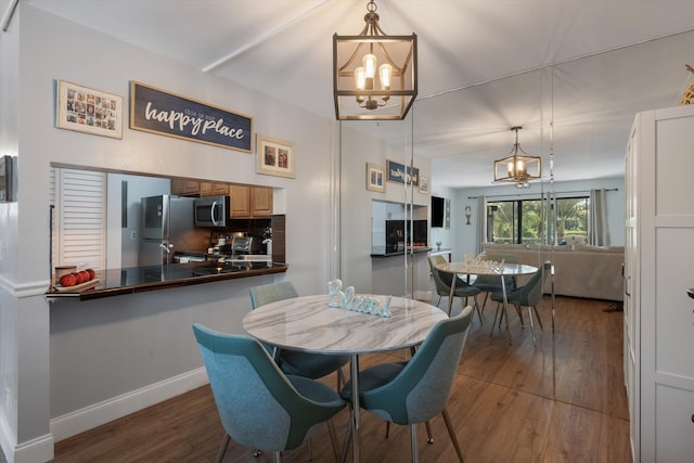 624 Sea Pine Way Unit A2, Greenacres, FL 33415 - dining space with a chandelier and wood finished floors
