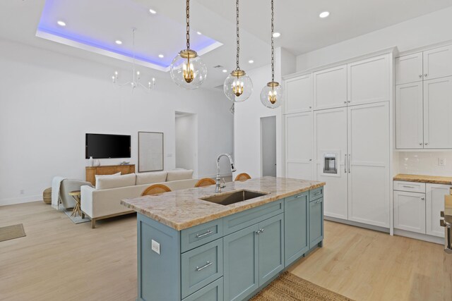 737 Nighthawk Way, North Palm Beach, FL 33408 - kitchen featuring appliances with stainless steel finishes, white cabinets, light wood-style floors, tasteful backsplash, and recessed lighting