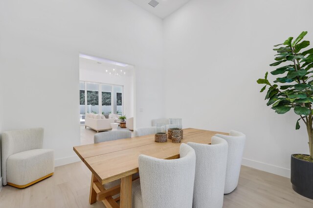 737 Nighthawk Way, North Palm Beach, FL 33408 - dining space with light wood-style flooring
