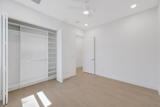 737 Nighthawk Way, North Palm Beach, FL 33408 - unfurnished bedroom featuring light wood-style flooring, a closet, ceiling fan, and recessed lighting