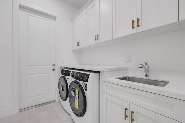 737 Nighthawk Way, North Palm Beach, FL 33408 - washroom featuring light marble finish floors, cabinet space, and washing machine and clothes dryer