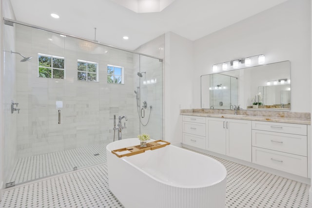 737 Nighthawk Way, North Palm Beach, FL 33408 - bathroom with a shower stall, a soaking tub, vanity, and recessed lighting