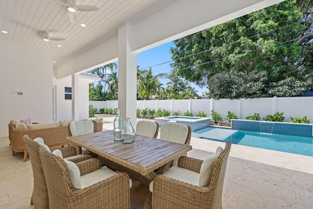 737 Nighthawk Way, North Palm Beach, FL 33408 - fenced backyard with a ceiling fan, a patio, and a pool with connected hot tub