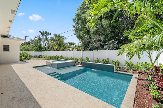 737 Nighthawk Way, North Palm Beach, FL 33408 - view of pool featuring a patio, a fenced backyard, and a pool with connected hot tub