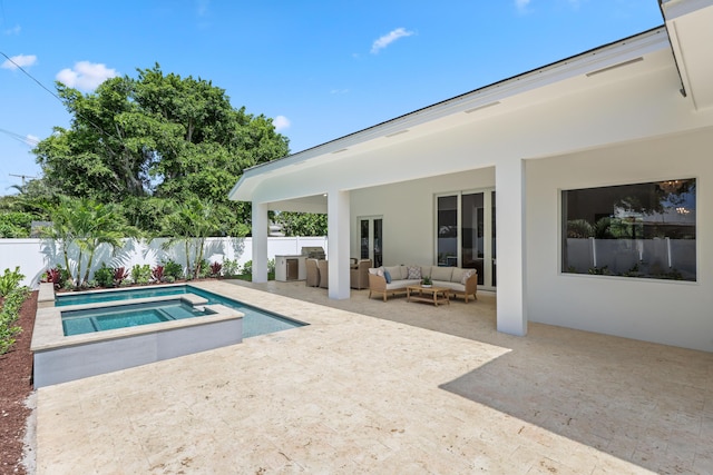 737 Nighthawk Way, North Palm Beach, FL 33408 - view of swimming pool featuring outdoor lounge area, a fenced backyard, a patio, a pool with connected hot tub, and french doors