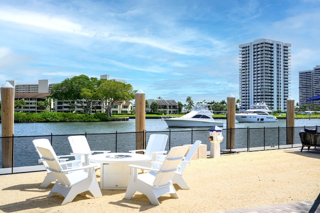 737 Nighthawk Way, North Palm Beach, FL 33408 - view of patio / terrace featuring a fire pit and a water view