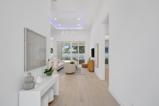 737 Nighthawk Way, North Palm Beach, FL 33408 - hall featuring a chandelier