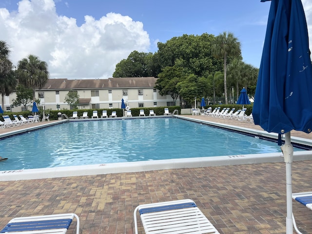 717 Gardens Dr Unit 106, Pompano Beach, FL 33069 - community pool with a patio area