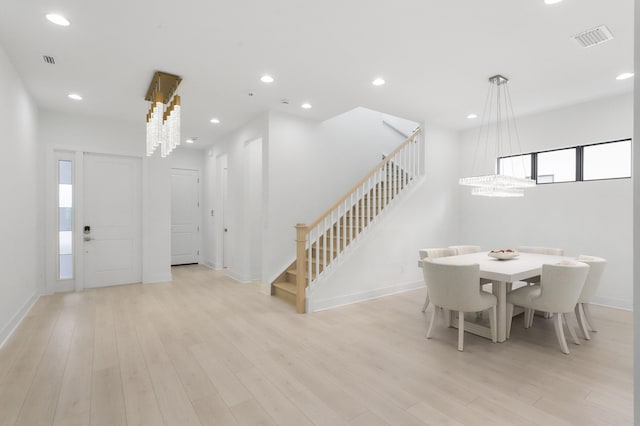 13214 Artisan Cir, Palm Beach Gardens, FL 33418 - dining area with stairs, recessed lighting, and light wood-type flooring