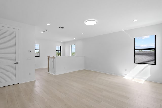 13214 Artisan Cir, Palm Beach Gardens, FL 33418 - spare room with recessed lighting and light wood-style flooring