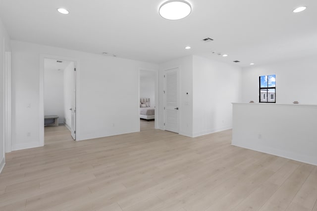 13214 Artisan Cir, Palm Beach Gardens, FL 33418 - spare room with light wood finished floors and recessed lighting