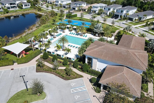 13214 Artisan Cir, Palm Beach Gardens, FL 33418 - aerial perspective of suburban area featuring a pool area and a nearby body of water