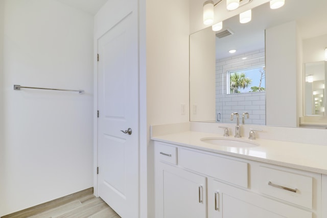 1416 Gopher Ter, Stuart, FL 34994 - full bath featuring vanity and wood finished floors