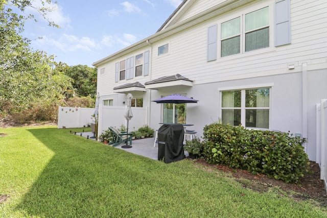1416 Gopher Ter, Stuart, FL 34994 - back of property with a patio and stucco siding