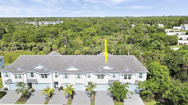 1416 Gopher Ter, Stuart, FL 34994 - aerial view of property and surrounding area featuring a forest