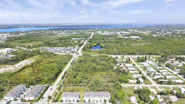 1416 Gopher Ter, Stuart, FL 34994 - aerial view of property and surrounding area with a large body of water and nearby suburban area