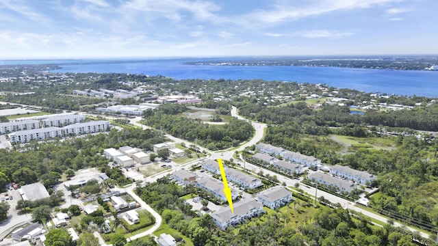 1416 Gopher Ter, Stuart, FL 34994 - aerial overview of property's location with a nearby body of water and a tree filled landscape